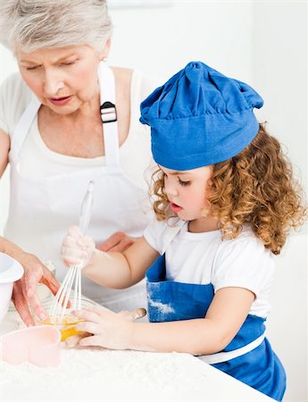 rolling over - A little girl  baking with her grandmother at home Stock Photo - Budget Royalty-Free & Subscription, Code: 400-04809157