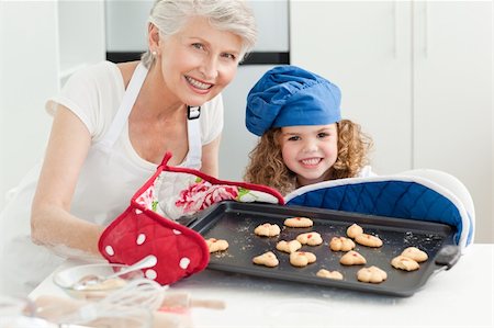 rolling over - A little girl baking with her grandmother at home Stock Photo - Budget Royalty-Free & Subscription, Code: 400-04809164