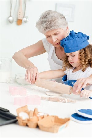 rolling over - A little girl baking with her grandmother at home Stock Photo - Budget Royalty-Free & Subscription, Code: 400-04809161