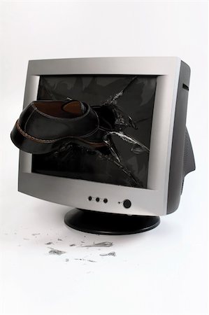 damaged shoe - computer monitor glass broken with a shoe Stock Photo - Budget Royalty-Free & Subscription, Code: 400-04809227