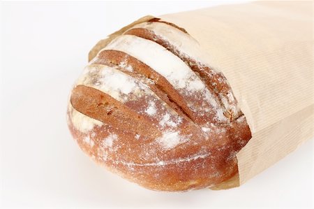 fresh bread in paper bag in the foreground Stock Photo - Budget Royalty-Free & Subscription, Code: 400-04809276