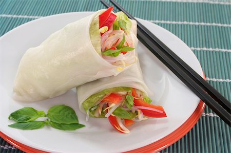 Lucky roll with lettuce, salmon, rice noodles, bell peppers and Thai basil Stock Photo - Budget Royalty-Free & Subscription, Code: 400-04809366