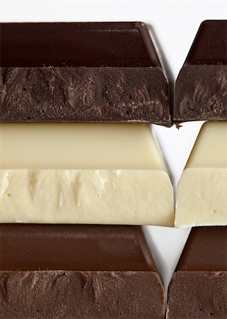 Stack of Black, Brown and White Chocolate isolated on white background Stock Photo - Budget Royalty-Free & Subscription, Code: 400-04809684