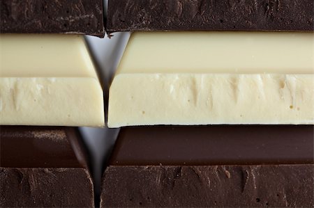 simsearch:400-08789726,k - Stack of Black, Brown and White Chocolate isolated on white background Photographie de stock - Aubaine LD & Abonnement, Code: 400-04809705