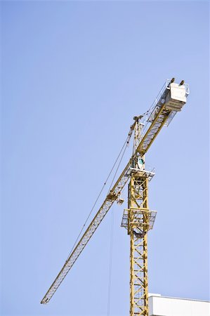 simsearch:400-06075932,k - Construction crane on blue sky Fotografie stock - Microstock e Abbonamento, Codice: 400-04809894