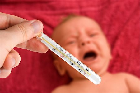 doctor patient thermometer - Mom check the temperature of ill baby Stock Photo - Budget Royalty-Free & Subscription, Code: 400-04809990