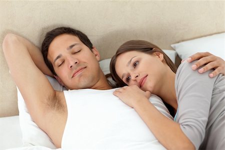 sleeping bed full body - Serene woman lying on her boyrfriend's arms while sleeping in their bedroom Stock Photo - Budget Royalty-Free & Subscription, Code: 400-04800247