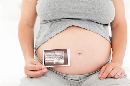 simsearch:400-04414996,k - Pregnant woman with her X-ray at home Stock Photo - Budget Royalty-Free & Subscription, Code: 400-04800522