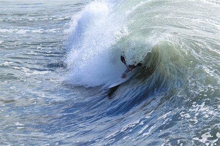 simsearch:400-06081165,k - Surfer riding a wave in the Pacific Ocean Foto de stock - Royalty-Free Super Valor e Assinatura, Número: 400-04800770