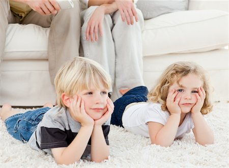 Adorable family watching tv in the living room Stock Photo - Budget Royalty-Free & Subscription, Code: 400-04800920