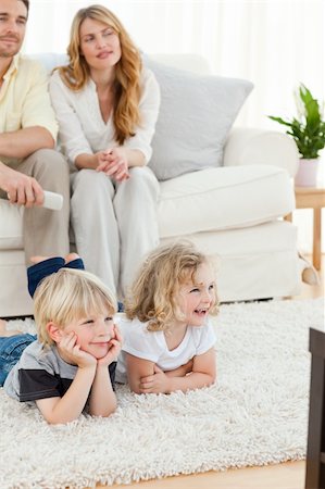 family on sofa popcorn - Adorable family watching tv in the living room Stock Photo - Budget Royalty-Free & Subscription, Code: 400-04800921