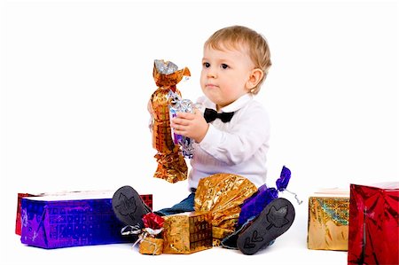 The little boy with the big sweet and gifts isolated Fotografie stock - Microstock e Abbonamento, Codice: 400-04801205