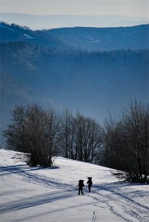footprint winter landscape mountain - Two tourists returning from a trip in the mountains Photographie de stock - Aubaine LD & Abonnement, Code: 400-04801292