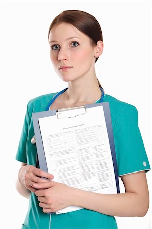 simsearch:400-04508758,k - Female doctor wearing green uniform and holding a clipboard with medical paperwork. Foto de stock - Super Valor sin royalties y Suscripción, Código: 400-04801312