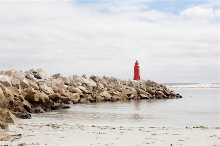 Harbor wall with lighthouse in LAmbert's Bay, West Coast, South Africa. Stockbilder - Microstock & Abonnement, Bildnummer: 400-04801972