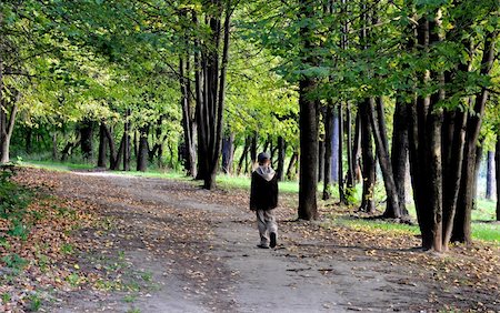 people with forest background - solitary boy walk in autumn forest park alone Stock Photo - Budget Royalty-Free & Subscription, Code: 400-04802128