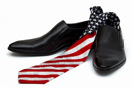 foot wear dress - Black man's shoes and necktie with a coloring in style of a flag of America, on the white background, isolated Stock Photo - Budget Royalty-Free & Subscription, Code: 400-04802305