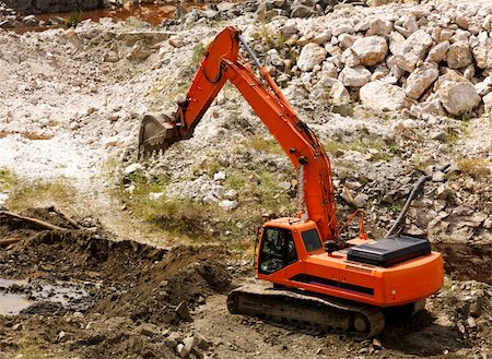 excavator during earthmoving works outdoors at construction site Stock Photo - Budget Royalty-Free & Subscription, Code: 400-04802509