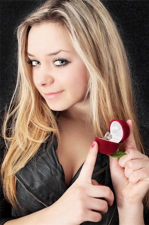 diamonds on black background - Beautiful blond holds in the hands box the ring Stock Photo - Budget Royalty-Free & Subscription, Code: 400-04802633