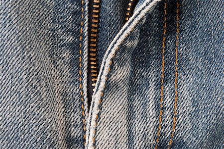 Close up of a zipper of a pair of blue jeans Foto de stock - Super Valor sin royalties y Suscripción, Código: 400-04802820