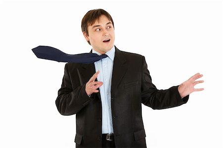 simsearch:400-05687698,k - Shocked  young businessman with blowing tie isolated on white Stock Photo - Budget Royalty-Free & Subscription, Code: 400-04803074