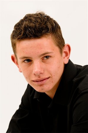 young short haired teenager with bad skin and acne smiling Stockbilder - Microstock & Abonnement, Bildnummer: 400-04803291