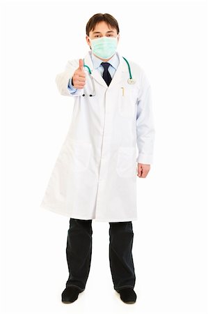 Medical doctor wearing mask and showing  thumbs up gesture isolated on white Stock Photo - Budget Royalty-Free & Subscription, Code: 400-04803472