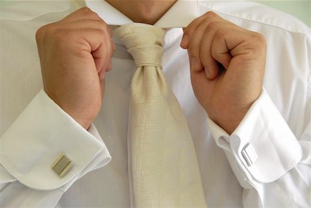 male hands with cuff links in shirt holding white collar Stock Photo - Budget Royalty-Free & Subscription, Code: 400-04803927