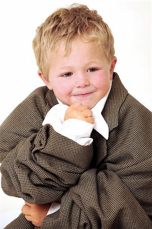 Blond young Boy in oversized business clothes in thinking position Stockbilder - Microstock & Abonnement, Bildnummer: 400-04803930