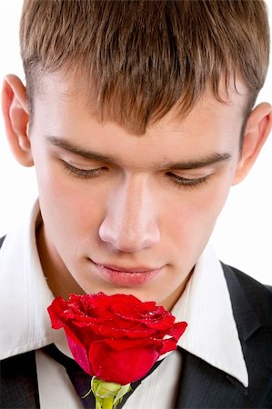 man smelling a rose. Isolated Fotografie stock - Microstock e Abbonamento, Codice: 400-04803945