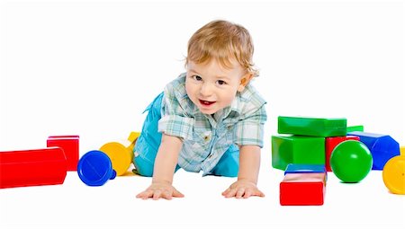 Cute little baby boy with colorful building blocks isolated on white Fotografie stock - Microstock e Abbonamento, Codice: 400-04803986