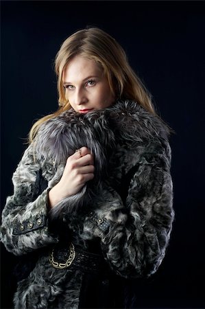 simsearch:400-05051542,k - beautiful woman in a fur coat at black background Stock Photo - Budget Royalty-Free & Subscription, Code: 400-04803998