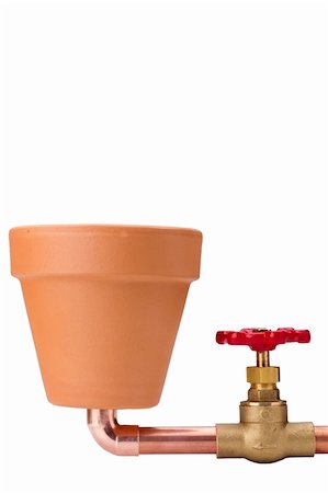 Creativity on the connection of water for irrigation. Water System been placed to ceramic grorshku for planting. Stock Photo - Budget Royalty-Free & Subscription, Code: 400-04814024