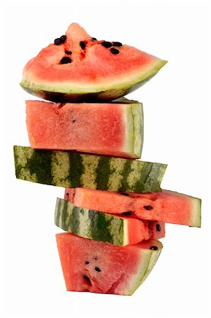 red water melon - Pyramide d'empilés de tranches de melon d'eau isolé sur fond blanc Photographie de stock - Aubaine LD & Abonnement, Code: 400-04814310