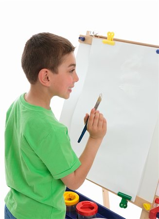 school boy in shorts - A boy with paintbrush in hand ready to paint Stock Photo - Budget Royalty-Free & Subscription, Code: 400-04814402
