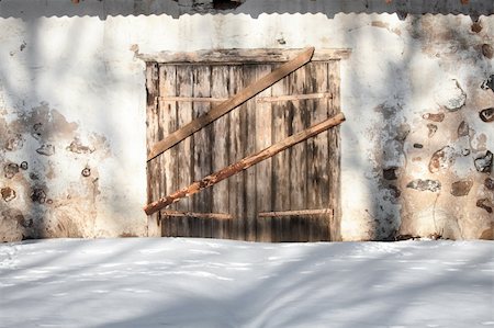 Wooden gates of an old bricks and stones building Stock Photo - Budget Royalty-Free & Subscription, Code: 400-04814894