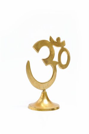 simsearch:400-05297167,k - Figure of golden indian symbol aum. isolated on white background Fotografie stock - Microstock e Abbonamento, Codice: 400-04815530