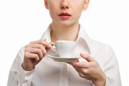 Portrait of a beautiful businesswoman in a white shirt drinking coffee or tea. Isolated on white background Fotografie stock - Microstock e Abbonamento, Codice: 400-04815585