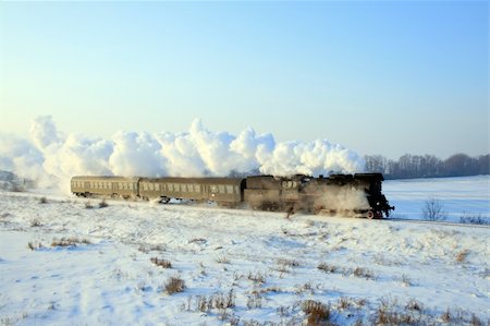 Vintage steam train passing through snowy countryside Stock Photo - Budget Royalty-Free & Subscription, Code: 400-04815735