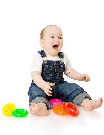 boy playing with colorful pyramid toy isolated on white Stockbilder - Microstock & Abonnement, Bildnummer: 400-04815770