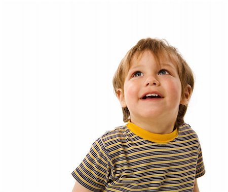 Happy Boy looking up laughing isolated on white Stockbilder - Microstock & Abonnement, Bildnummer: 400-04815788