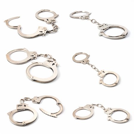 simsearch:400-05300234,k - silver handcuffs collection isolated on white background Fotografie stock - Microstock e Abbonamento, Codice: 400-04815840