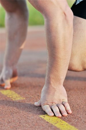 sprinters at finishing line - healthy young man at start line ready for run race and win Stock Photo - Budget Royalty-Free & Subscription, Code: 400-04816016