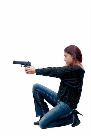 A young and beautiful Hispanic woman police detective holding a handgun Stock Photo - Budget Royalty-Free & Subscription, Code: 400-04816326