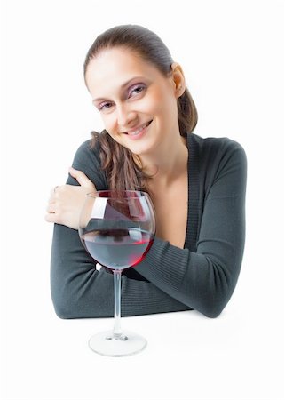 Beautiful young lady with a charming smile and soft relaxing expression with a glass of red wine isolated on a white background Stock Photo - Budget Royalty-Free & Subscription, Code: 400-04816564