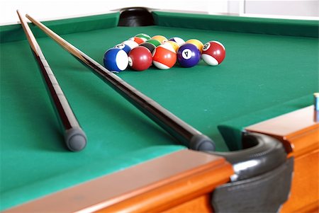 billiards green table with balls and two black cues Stock Photo - Budget Royalty-Free & Subscription, Code: 400-04816622