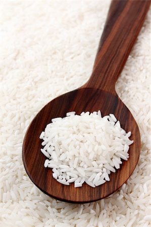 white rice inside and outside the wooden spoon Stock Photo - Budget Royalty-Free & Subscription, Code: 400-04816732
