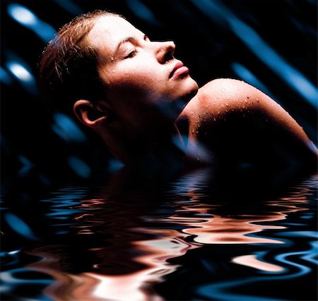 The young sexual woman in splashes of water. Flying drops. Water studio photo. Stock Photo - Budget Royalty-Free & Subscription, Code: 400-04816787