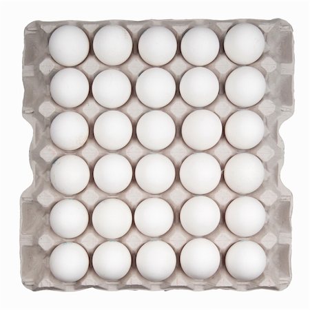 egg carton - white eggs isolated on white Photographie de stock - Aubaine LD & Abonnement, Code: 400-04817304