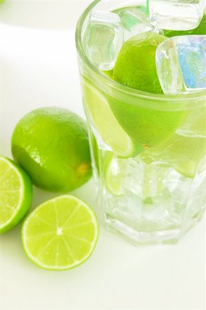 simsearch:400-04787910,k - Caipirinha cocktail with green lemon and ice cubes Stock Photo - Budget Royalty-Free & Subscription, Code: 400-04817917